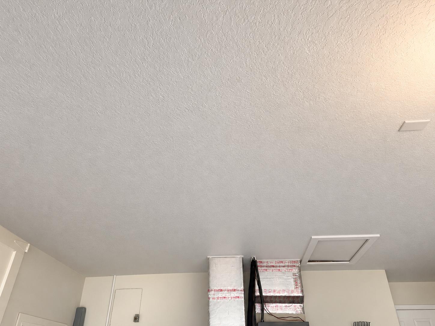 Repaired ceiling with knockdown texture and fresh paint